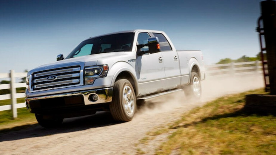A 2014 Ford F-150 is driving after having its battery jumped.