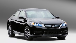 A used 2014 Honda Accord shows off its black paint work and fascia.