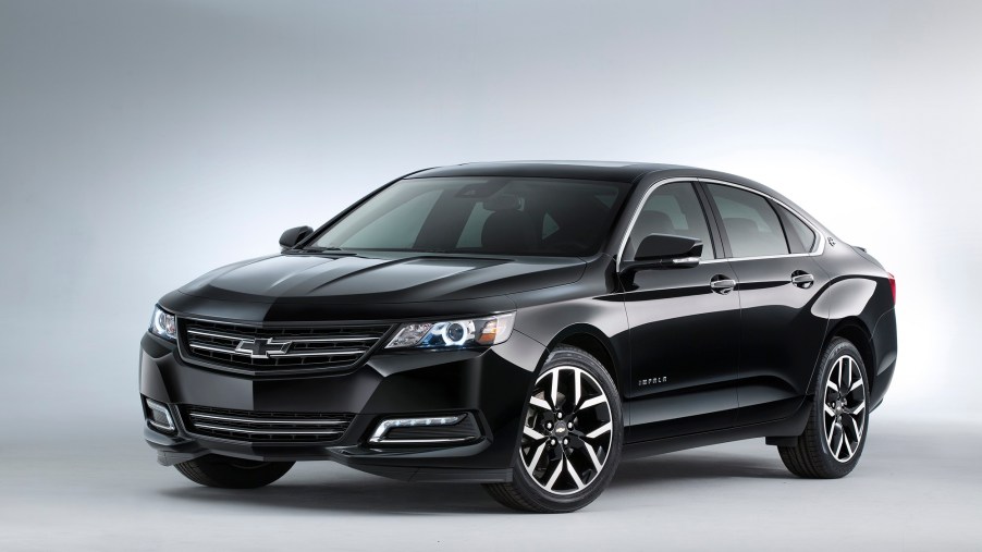 A black Chevy Impala has no problem looking the part while it shows off its fascia and sedan lines.