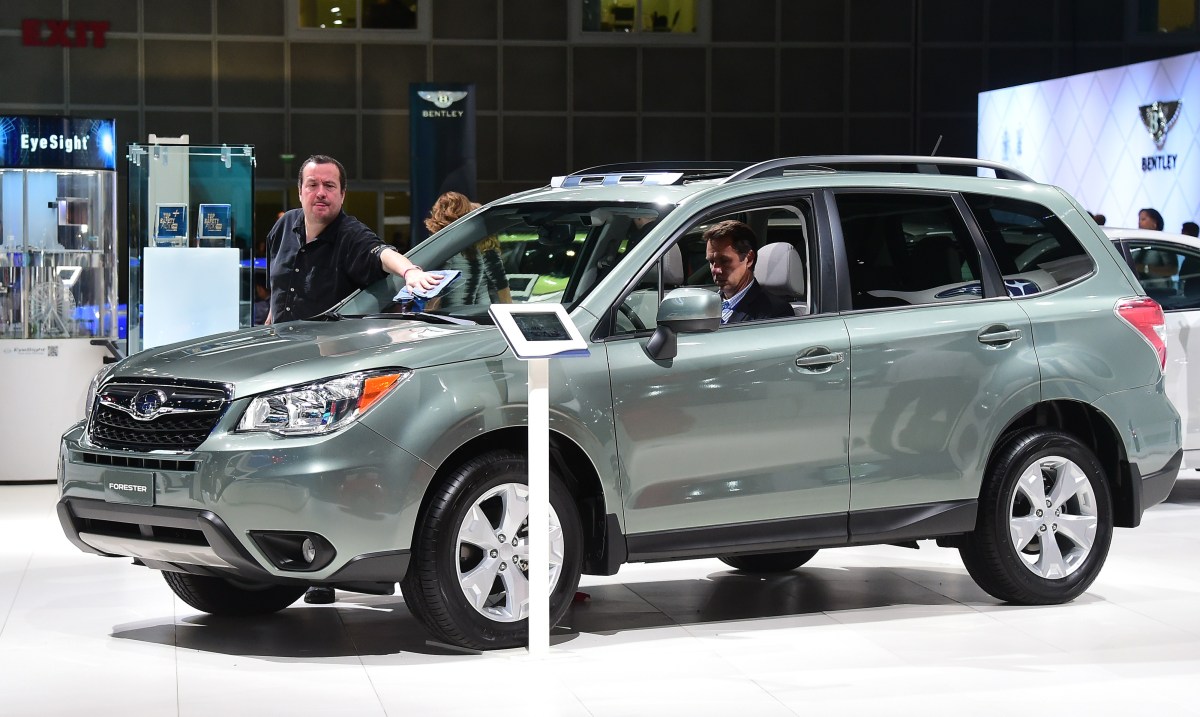 A Subaru Forester on display at an auto show.