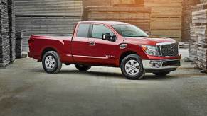 A red nissan titan sits in a warehouse