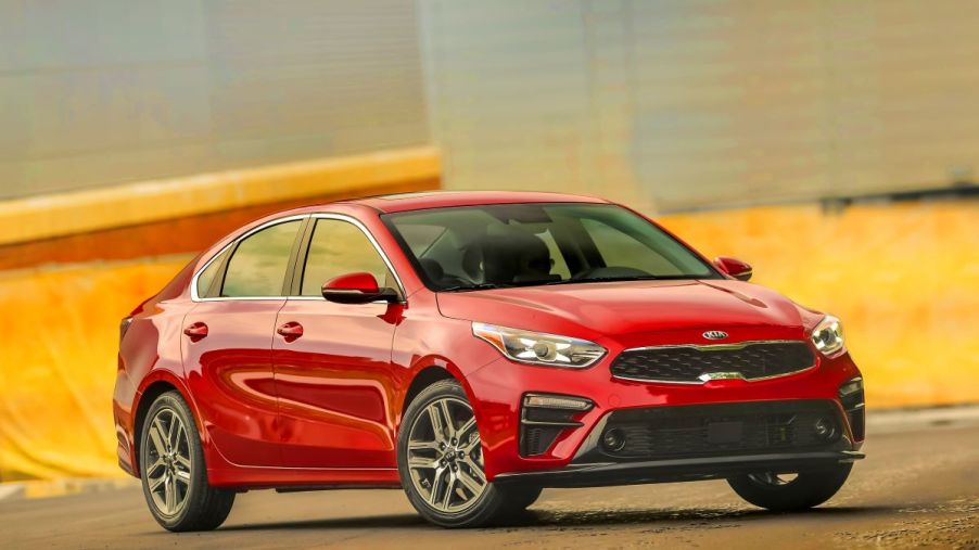A red 2020 Kia Forte parked in a lot