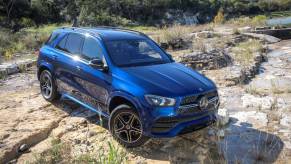 A blue 2020 Mercedes-Benz GLE 350 4MATIC luxury SUV model parked in the wilderness