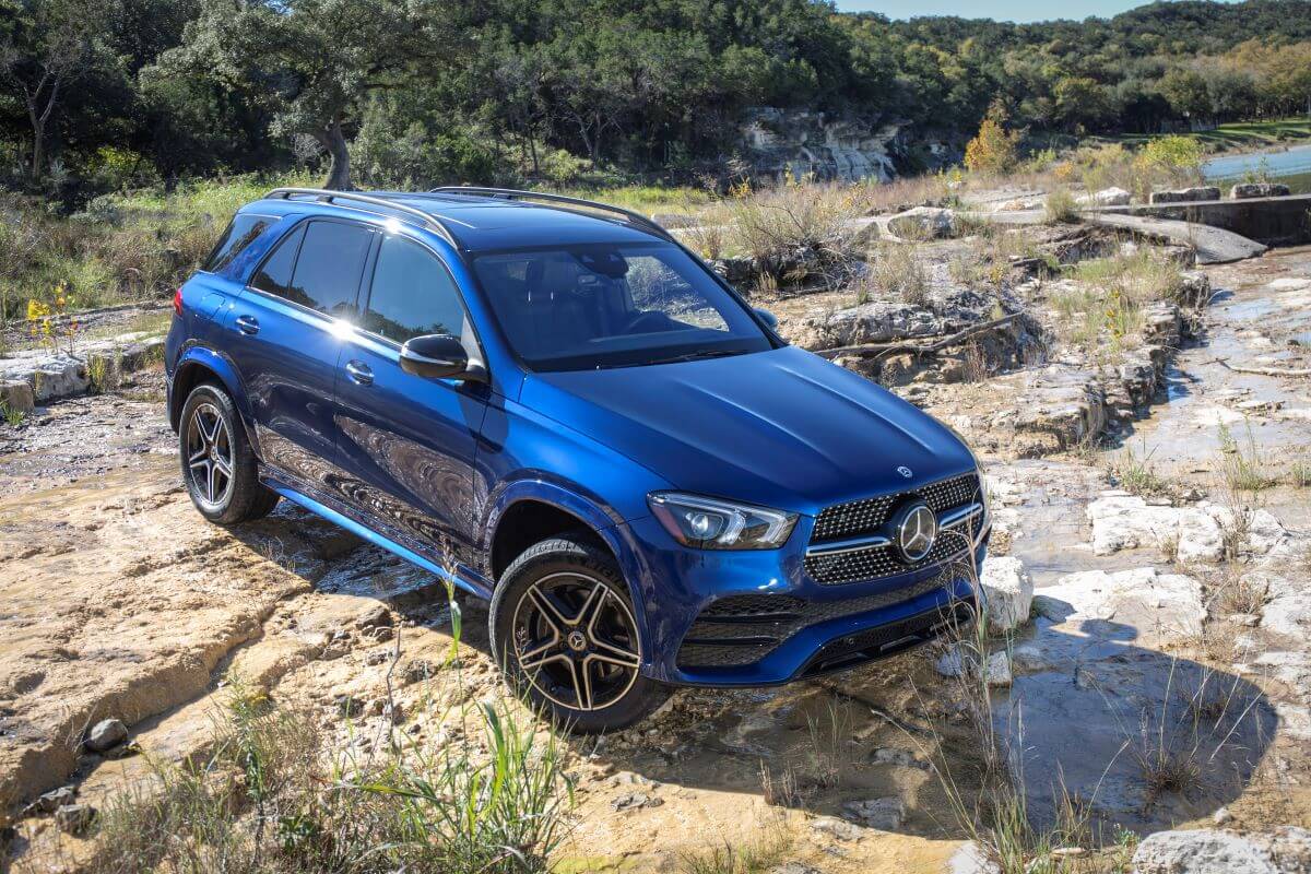 A blue 2020 Mercedes-Benz GLE 350 4MATIC luxury SUV model parked in the wilderness