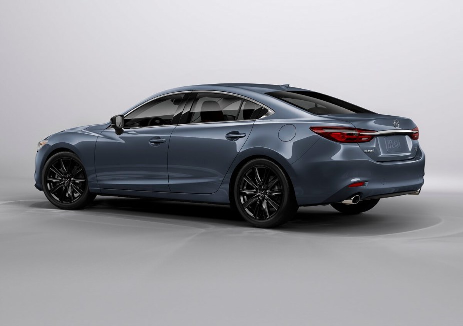 A used Mazda6 model shows off its midsize car proportions and rear-end styling. 