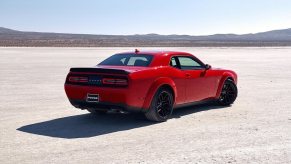 A 2023 Dodge Challenger SRT Hellcat Widebody shows off its muscle car styling and large proportions.