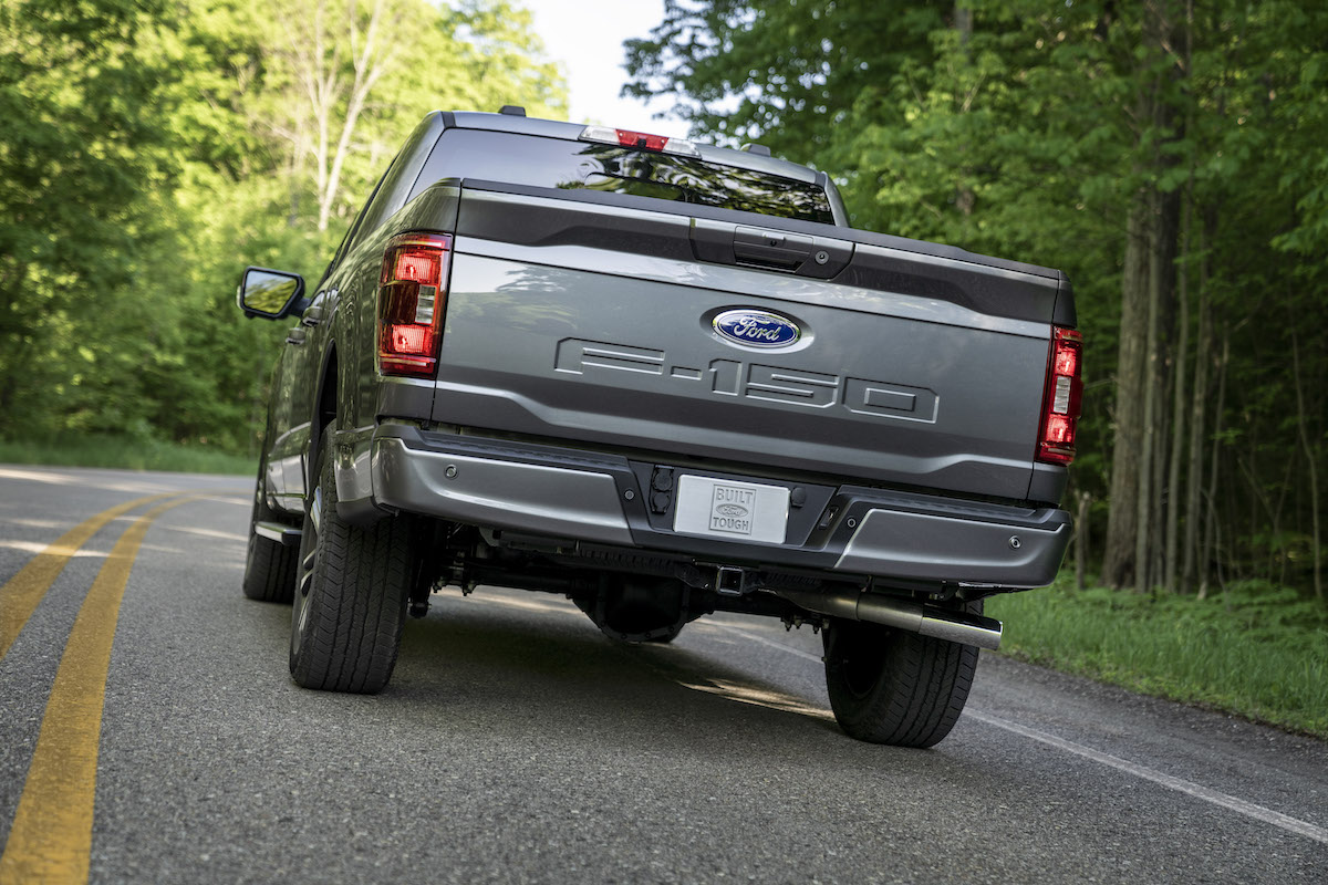 A 2023 Ford F-150 driving down the road, which is one of the best full-size trucks of 2023.