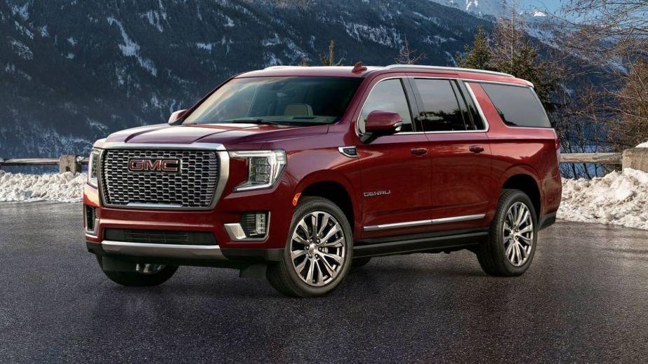 2022 GMC Yukon Denali Full-Size SUV posed in front a snow-covered mountain