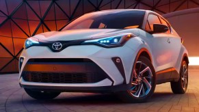 A white 2022 Toyota C-HR subcompact SUV is parked.