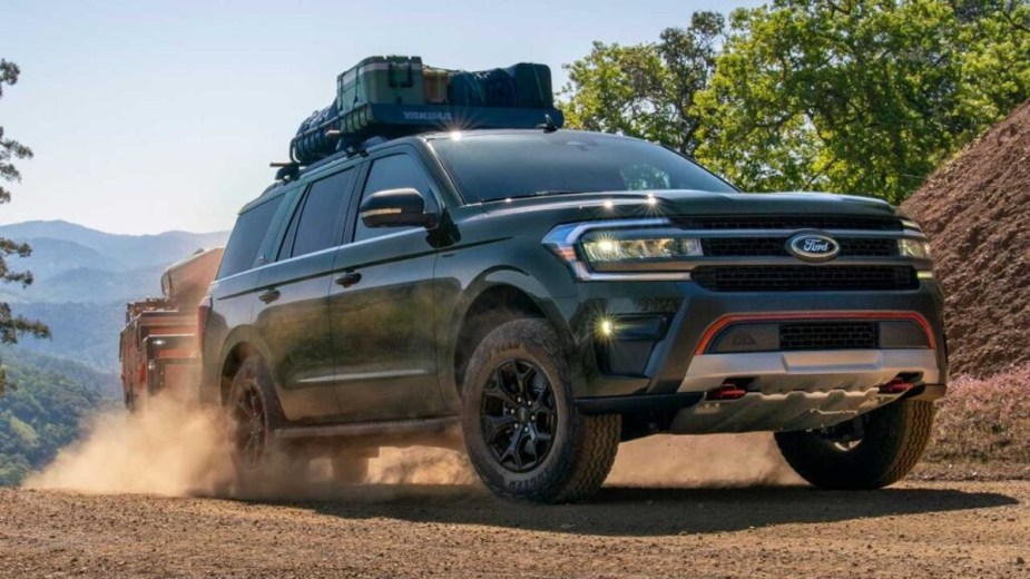 2023 Ford Expedition Towing a trailer on a dirt trail
