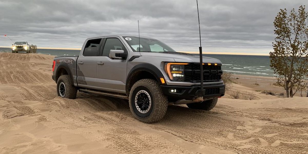 Raptor R, one of two pickup trucks with terrible fuel efficiency, is driving on a dirt trail