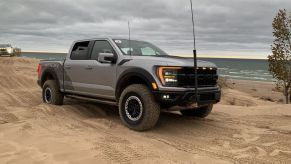 Raptor R, one of two pickup trucks with terrible fuel efficiency, is driving on a dirt trail