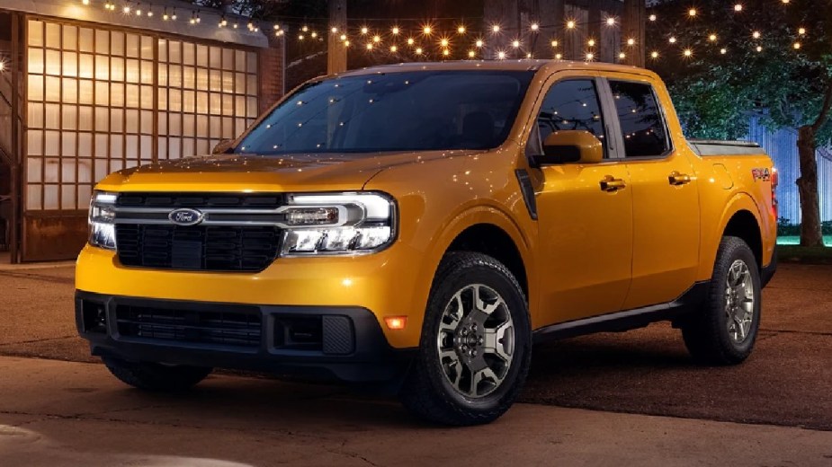 2023 Ford Maverick, most reliable Ford, says Consumer Reports, and cheapest new pickup truck, parked under lights