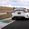 A white 2023 Honda Civic Type R performance hatchback model at the Sonoma Raceway track