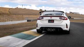 A white 2023 Honda Civic Type R performance hatchback model at the Sonoma Raceway track