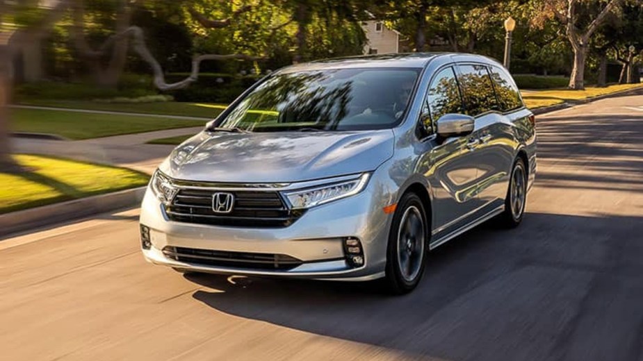 Silver 2023 Honda Odyssey Driving on a Road