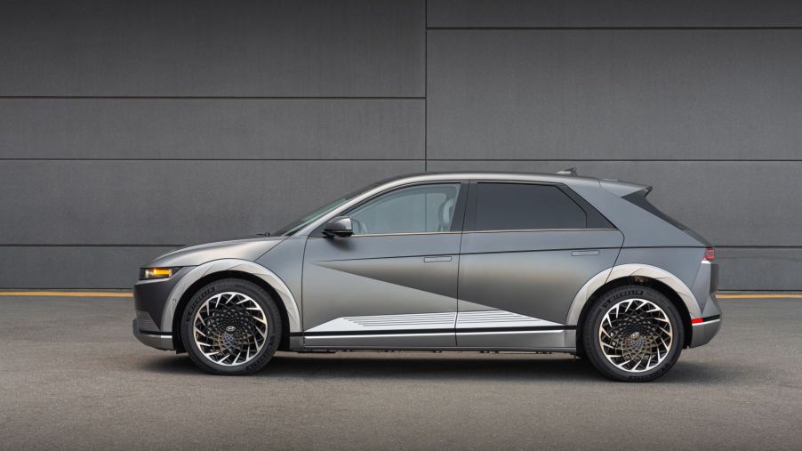 A side exterior profile shot of a silver-gray 2023 Hyundai Ioniq 5 all-electric (EV) compact SUV model