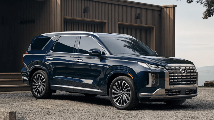 The 2023 Hyundai Palisade parked by a home