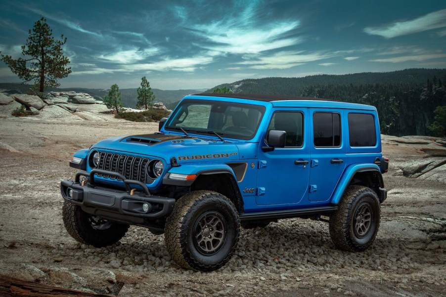 A blue 2023 Jeep Wrangler parked outdoors.