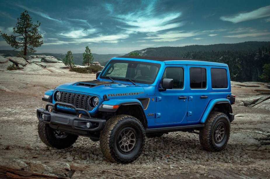 A blue 2023 Jeep Wrangler parked outdoors. 