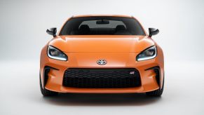 A 2023 Toyota GR86 sports car shows off its fascia and LED lights.
