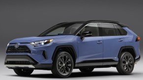 A blue 2023 Toyota RAV4 small SUV is parked.