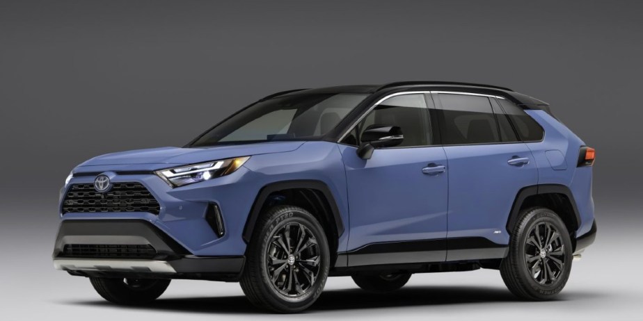 A blue 2023 Toyota RAV4 small SUV is parked. 