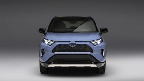 A light blue 2023 Toyota RAV4, which is one of three, so which RAV option Is cheapest to own.