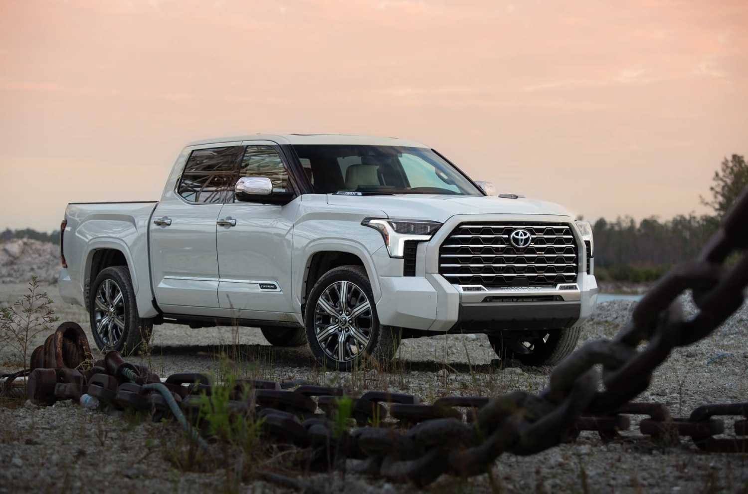 The 2023 Toyota Tundra Hybrid Capstone in front of a pink sky