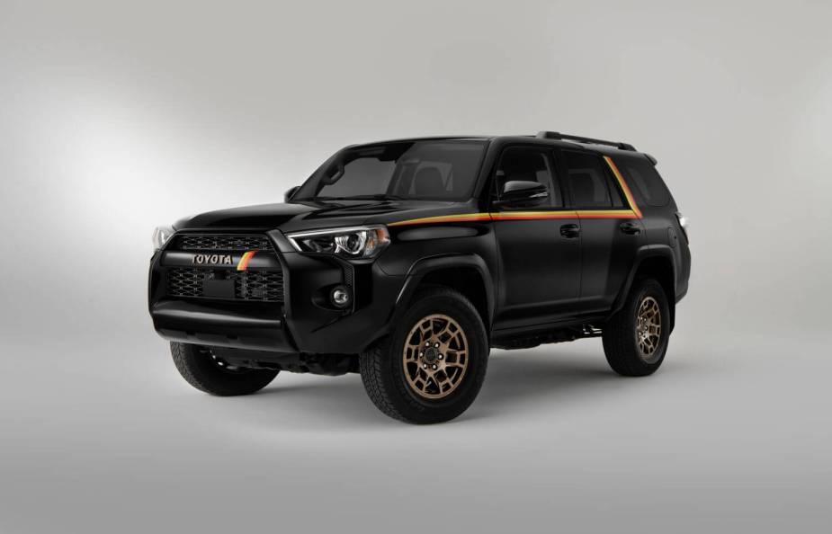 Promo photo of the 40th-anniversary special edition of the 2023 Toyota 4Runner in black with an orange stripe, the cheapest 3rd row 4WD.