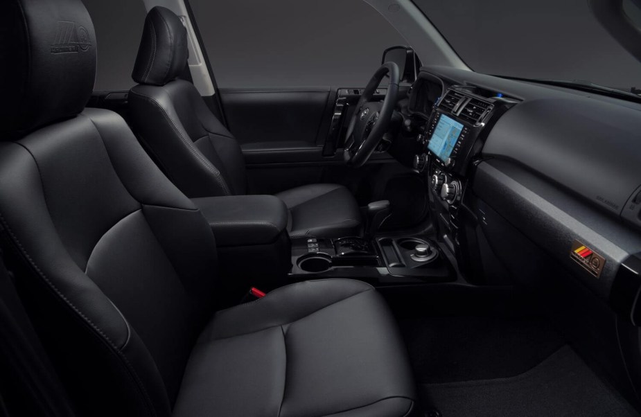 The black interior of a 40th anniversary edition 2023 Toyota 4Runner with an available 3rd-row and 4WD.