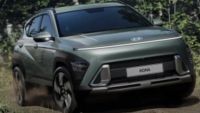 A green 2024 Hyundai Kona subcompact SUV is parked.
