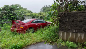 Abandoned Mk4 Toyota Supra in red in Fukushima