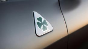 The Alfa Romeo Quadrifoglio badge on a Giulia sedan model