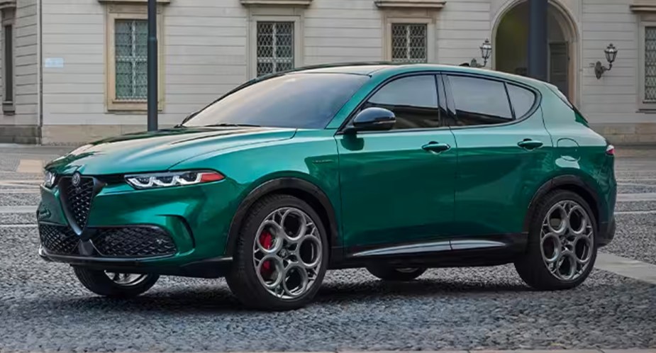 A green 2023 Alfa Romeo Tonale small luxury plug-in hybrid SUV is parked.