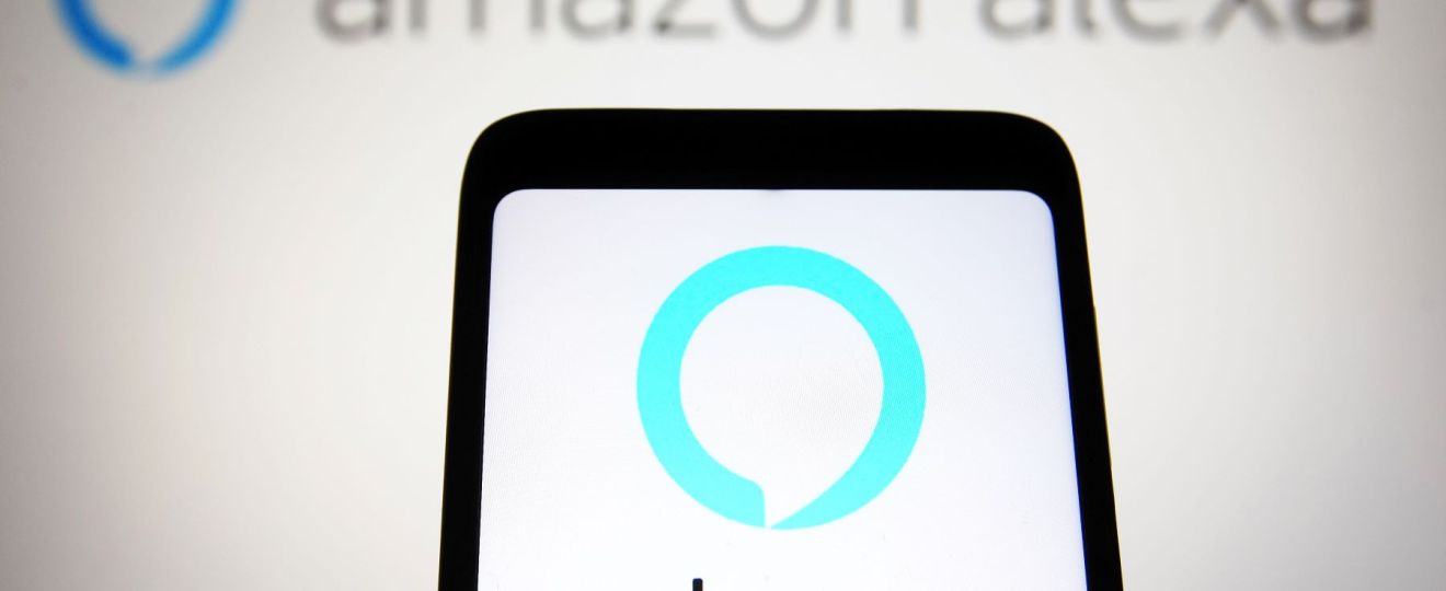 An Amazon Alexa graphic on a smartphone and in the background