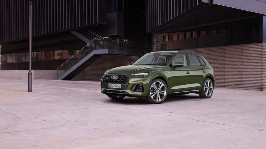 A great SUV to buy, the Audi Q5, sitting outside a building.