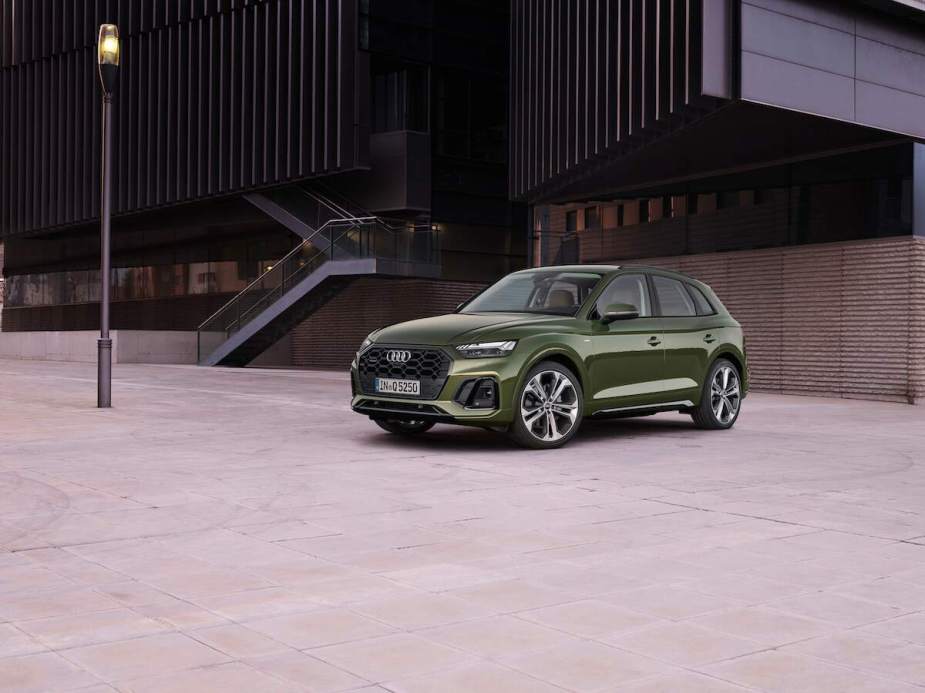 A great SUV to buy, the Audi Q5, sitting outside a building.