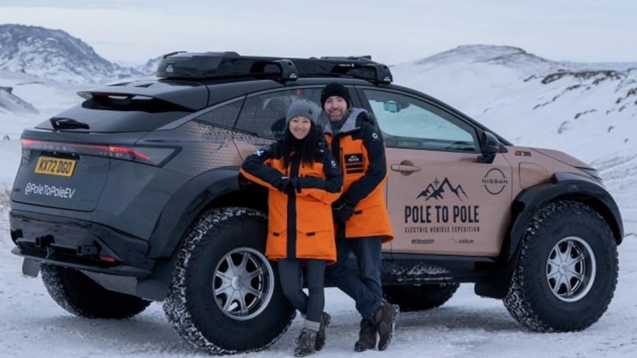 Chris and Julie Ramsey in front of the Pole to Pole Nissan Ariya