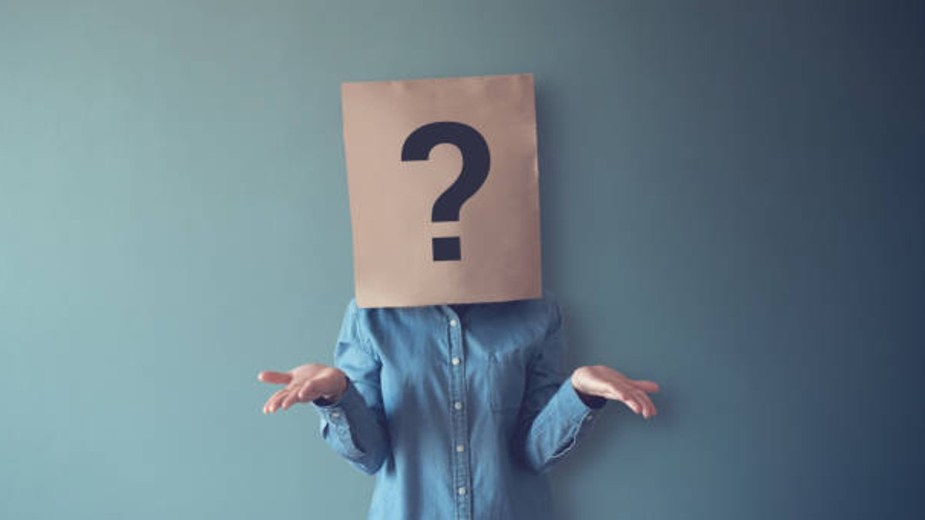 Confused Person - Woman with brown bag over her head with a question mark on it