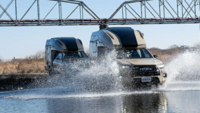 Direct Cars Toyota Hilux Camper splashing through a river