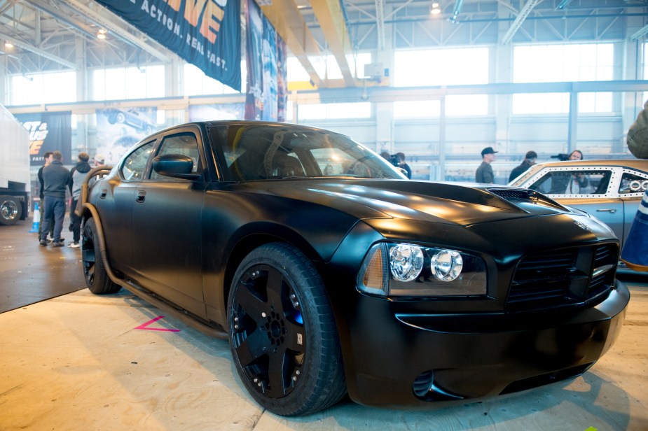 A black Dodge Charger SRT-8 car that appeared in the Fast and Furious 5 movie parked in a museum.