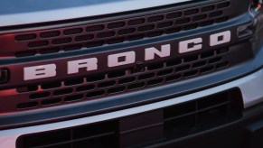 A Ford Bronco logo on the front of a Bronco.