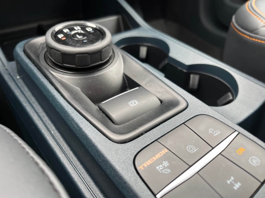 The electronic parking brake button in a Ford Maverick