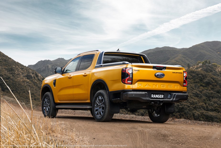 A yellow Ford Ranger in a mountainous area. 