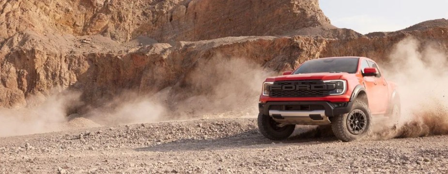 A red Ford Ranger Raptor shows off as an off-road truck.