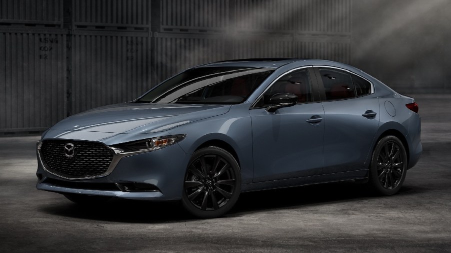 Front angle view of blue 2023 Mazda3 Sedan, the cheapest new Mazda car in 2023
