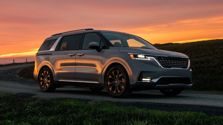 Front angle view of gray 2023 Kia Carnival, second-best new minivan to buy in 2023, says Car and Driver