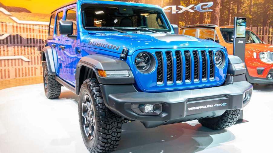 A blue Jeep Wrangler parked indoors.