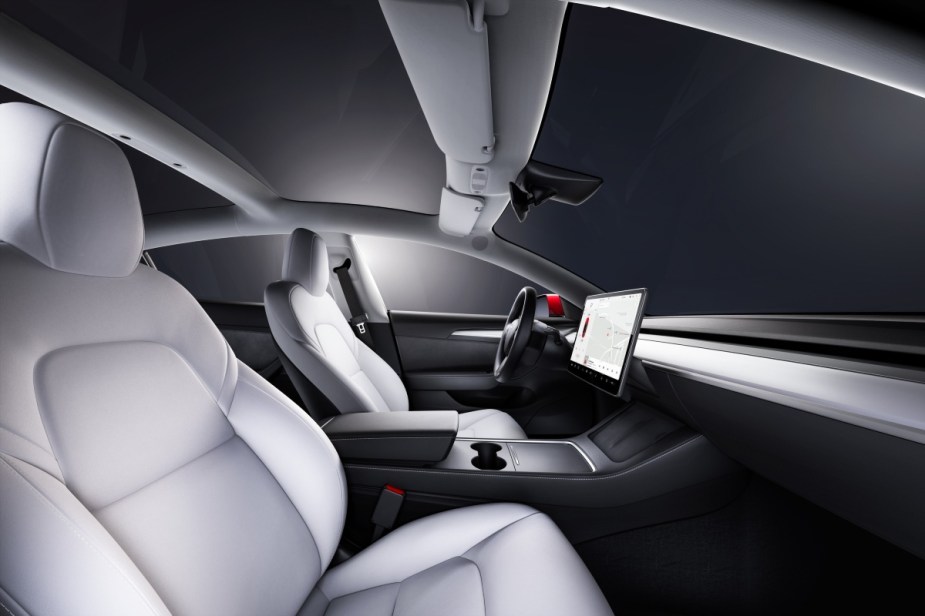 Gray seats in 2023 Tesla Model 3, showing how it's cheap as 2023 Toyota Corolla in some places